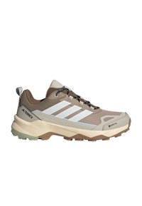 Beige a hnědé hiking boty Adidas Terrex s bílými pruhy, černými tkaničkami, robustní podrážkou, materiálem Gore-Tex a Lightmotion odpružením.