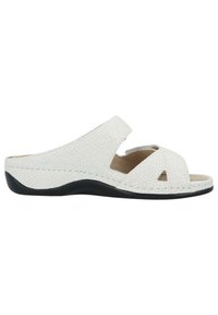 White slip-on sandals featuring a textured upper, open toe, cross strap design, and a black outsole. Interior lined for comfort.