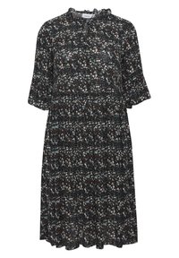 Kukallinen mekko tummasta kankaasta, jossa on frilla kauluksessa, lyhyet hihat ja kerroksellinen muotoilu sinisten, valkoisten ja ruskeiden kukkakuviolien kanssa.