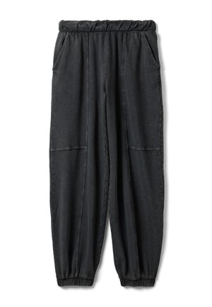 Pantalon de survêtement noir fuselé avec taille et poignets élastiques, poches latérales et détails de coutures visibles au niveau des genoux.