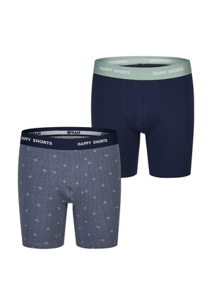 Zwei Paare Herren-Boxershorts. Das eine ist dunkelblau mit einem grünen Bund, das andere grau mit einem Palmenmuster und einem dunkelblauen Bund.