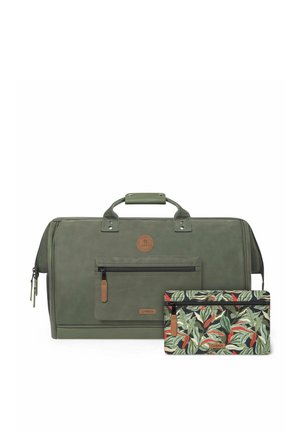 Green rectangular travel bag with front zipper pocket and handle, accompanied by a smaller pouch featuring a colorful leafy pattern and front zipper.
