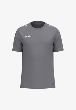 T-shirt de sport gris uni à manches courtes avec logo JAKO sur la poitrine et icônes rondes imprimées sur les bandes d'épaule.