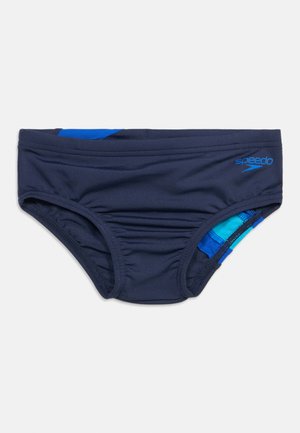 Navy blue Speedo swim brief with lighter blue accents and elastic waistband, flat-laid on white background.