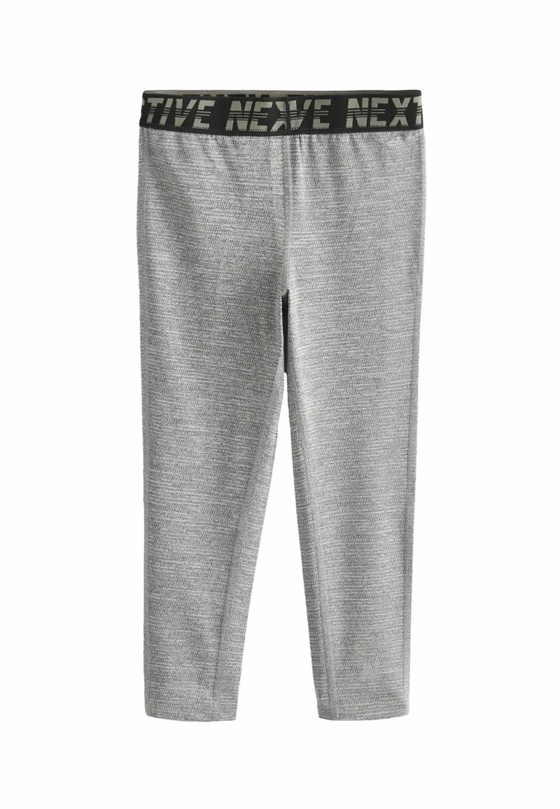 Grijze leggings met een textuurpatroon, voorzien van een zwarte elastische tailleband met het "NEX"-merk. Strak model, geschikt voor sportkleding.