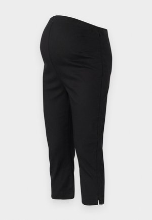 Fekete, elasztikus derékpántos, cropped hosszúságú stretch nadrág, oldalsó hasítékokkal az alján a szabad mozgás érdekében. Sima textúra.