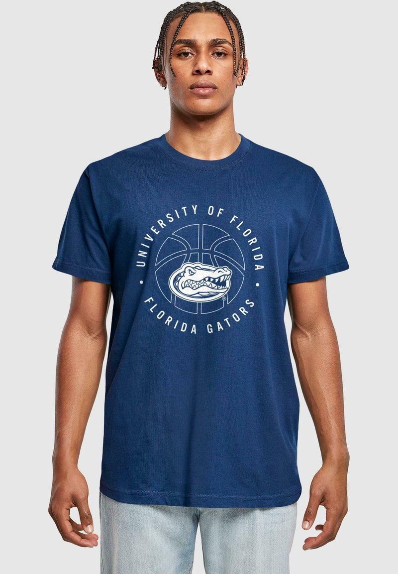 Granatowa bawełniana koszulka z białą okrągłą grafiką przedstawiającą wzór koszykarskiego boiska oraz napisem "University of Florida Florida Gators".