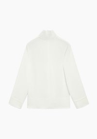 Weißes Langarmshirt mit hohem Kragen, minimalistischem Design und glatter Textur. Mit Reißverschluss auf der Rückseite und umgeschlagenen Manschetten.