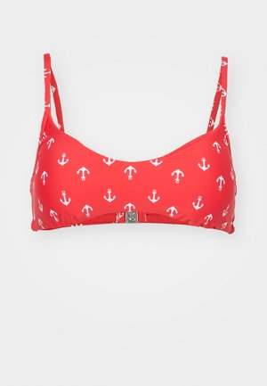 Rdeč bikini top z belim vzorcem sidra, nastavljive naramnice in srebrno zaponko spredaj. Gladek, elastičen material.