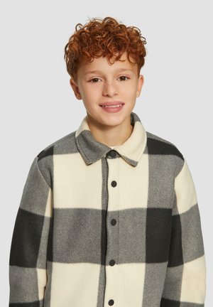 Fleece-Hemdenjacke mit einem schwarz-weißen karierten Muster, ausgestattet mit Kragen, Knopfleiste vorne und weicher Textur.