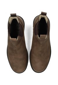 Botas de tobillo de cuero marrón con un acabado suave, paneles laterales elásticos y forro de pelo de oveja. Diseño fácil de poner con una lengüeta para facilitar el uso.