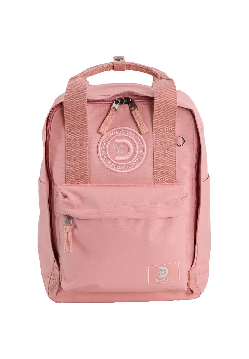 Pink fabric backpack with padded top handle, two adjustable straps, front zip pocket, and embossed logo. Smooth texture, compact rectangular shape.