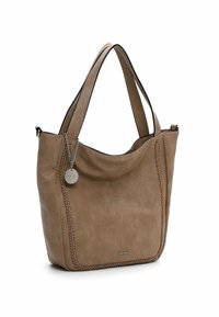 Tan leather tote bag with braided stitching, dual handles, and a silver logo tag. The design features a soft texture and structured shape.