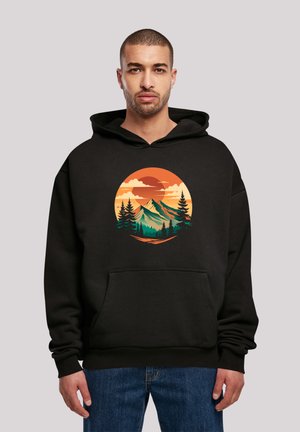Black hoodie featuring a colorful mountain and forest graphic in a circular design. Includes a front pouch pocket and drawstring hood.