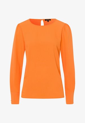 Halenka s dlouhým rukávem v jasně oranžové barvě, vyrobená z hladké látky. Kulatý výstřih s malým průstřihem vzadu, přiléhavý střih.