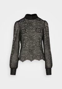 Blouse en dentelle noire avec manches longues et col montant. Motif floral, ourlet festonné et poignets en tissu noir uni. Fermeture éclair au dos.