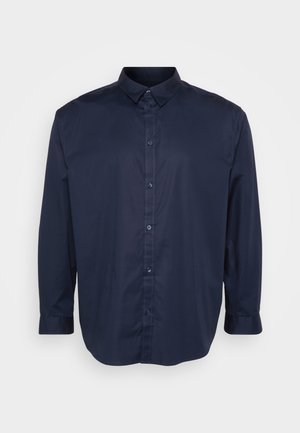 Camicia a maniche lunghe blu navy realizzata in tessuto liscio, con colletto a punta, chiusura con bottoni sul davanti e orlo arrotondato.