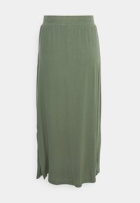 Olivgrön, ankellång kjol gjord av mjukt tyg. Har ett elastiskt midjeband och sidofickor för lätt rörlighet. Slät yta.