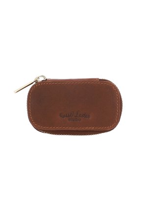 Brown leather zipper pouch with rounded edges, embossed logo, and gold hardware accent. Smooth texture and compact rectangular shape.