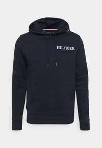 Sudadera azul marino de algodón, con bolsillo frontal, capucha con cordón y logo blanco "HILFIGER" en el pecho. Textura suave.