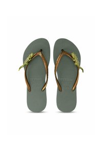Green flip-flops with textured footbeds, brown straps, and a decorative, detailed yellow lizard accent on each strap.