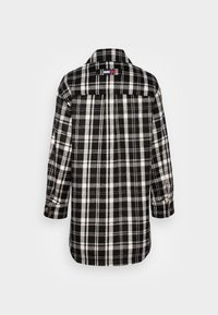 Černobílá kostkovaná flanelová košile, dlouhé rukávy, zapínání na knoflíky na manžetách, límec a rovný střih se zadním detailem v oblasti jha.