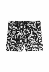 Bañadores en blanco y negro con un patrón geométrico, con una cintura elástica y cordón. Elaborados con un tejido ligero y de secado rápido.