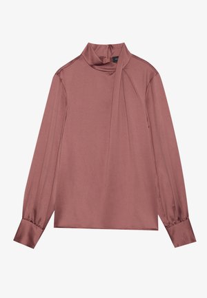 Blouse mauve à manches longues avec col haut, détail drapé sur le côté, poignets boutonnés et fermeture éclair au dos.