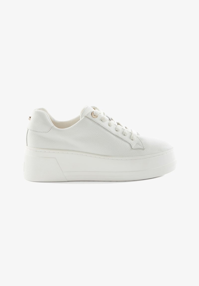 White platform sneakers made of textured leather, with flat laces, round toe, and minimalistic design. Features subtle gold accents on eyelets.