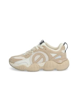 Beige and white sneaker with a mesh upper, padded collar, and thick rubber sole. Features a logo on the tongue and a pull tab at the heel.