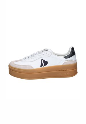 White and beige platform sneaker with thick gum sole, black heel accent, white laces, and black heart-shaped logo on side.