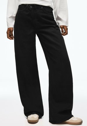 Bershka, DENIM WIDE CROSSED - Wide leg - black