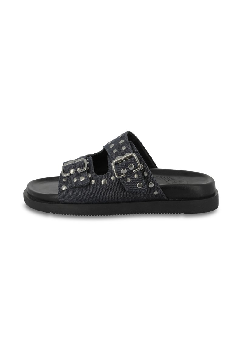 Dark blue denim slide sandals with dual buckle straps, silver studs, and a textured black rubber sole. Open-toe design with cutouts.