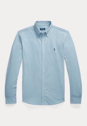 Lichtblauw overhemd met lange mouwen, knoopsluiting, knoopkraag en geborduurd Polo Ralph Lauren-logo op de borst.