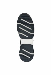 Semelle de chaussure en caoutchouc noir avec motif en zigzag blanc et canaux pour améliorer l'adhérence. Surface texturée pour renforcer la prise et la durabilité.