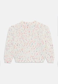Krémszínű kötött pulóver, texturált mintával, pink, kék és lila színű pöttyökkel. Kerek nyakkivágású.
