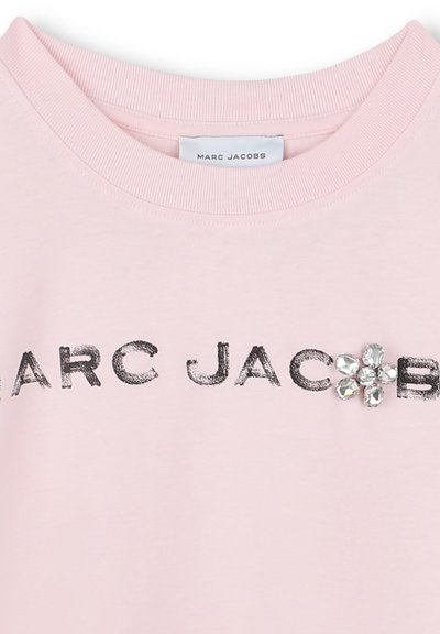 Pink sweatshirt with ribbed neck, featuring the text "MARC JACOBS" in black and a floral design of clear jewels on the left.