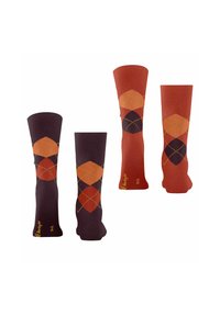 Chaussettes montantes à motif argyle en bordeaux, orange et marron. Présentent des formes de diamant et des coutures contrastantes. Texture de tissu douce.