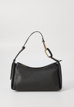 Black leather shoulder bag with a textured finish, curved shape, short handle, and gold hardware accents. Zippered closure on top.