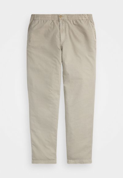 Calças caqui com cintura elástica, fecho de botão e bolsos laterais. Feitas de um suave e leve tecido de algodão, corte de perna reta.