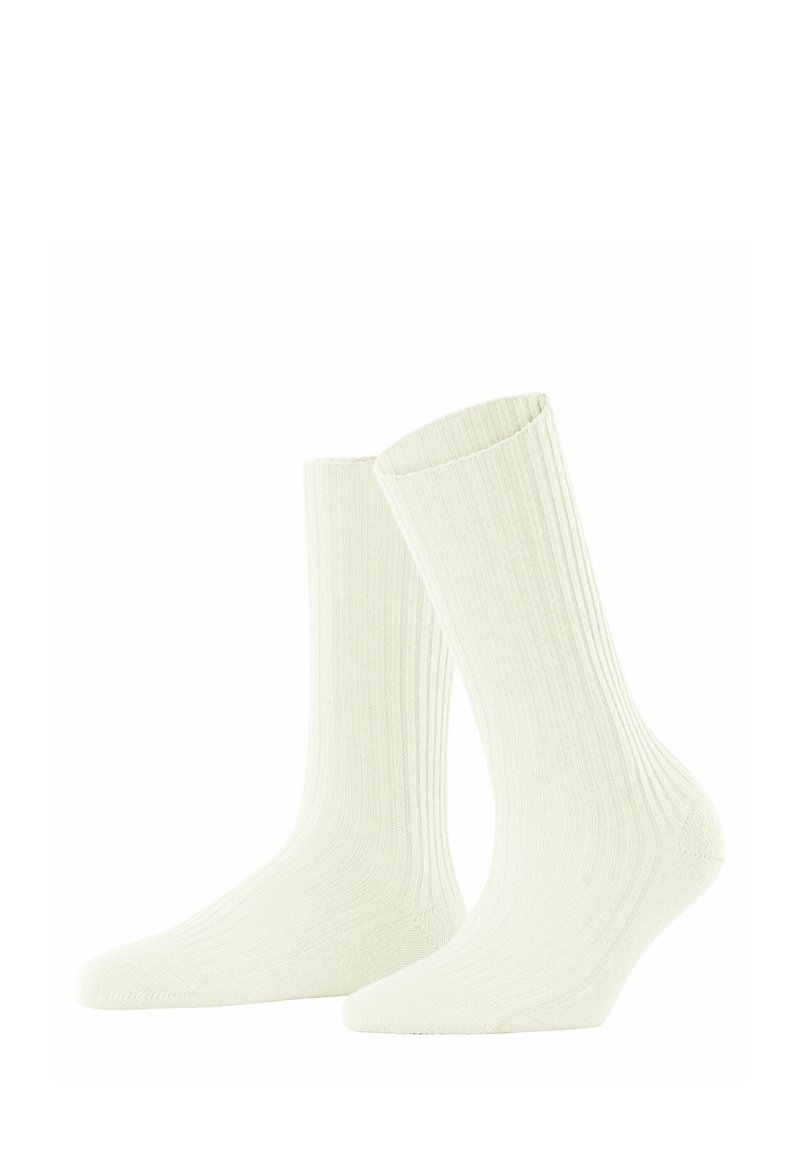 Calzini a coste color crema con un design di lunghezza media, caratterizzati da una texture morbida e una punta arrotondata, adatti per l'abbigliamento casual.