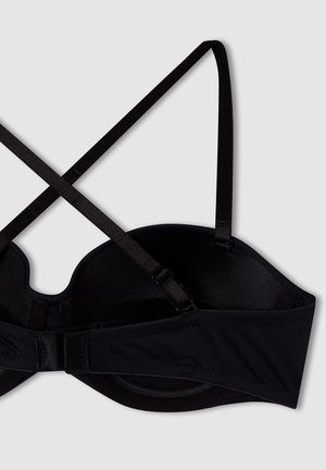 Reggiseno nero con ferretto e coppe removibili, realizzato in tessuto morbido e testurizzato, con spallacci incrociati e chiusura a gancetto, progettato per supporto e comfort.