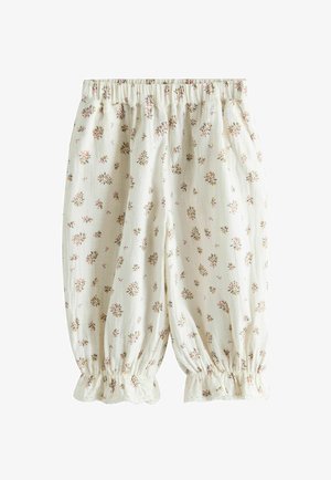 Pantalonași pentru bebeluși de culoare crem, cu imprimeuri florale mici multicolore, talie elastică și deschideri pentru picioare adunate, cu volane.