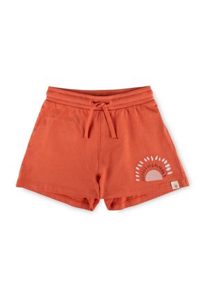 Rust-colored cotton shorts with drawstring waist and a sunburst design on the lower right leg against a white background.
