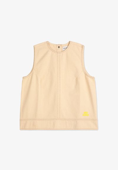 Beige sleeveless top made of cotton with a round neckline, featuring front stitching details and a small yellow graphic on the hem.