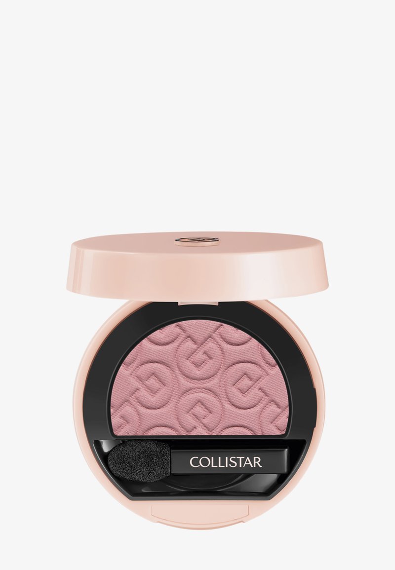 Poudrier de blush avec un couvercle rose pâle, une bordure intérieure noire, une poudre rose clair embossée et un applicateur en éponge portant l'inscription "COLLISTAR".