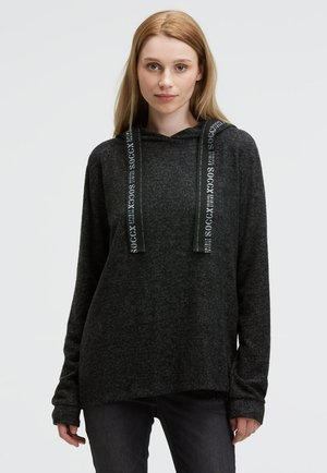 Dark gray hoodie made of soft, textured fabric. It features black drawstrings with printed text, long sleeves, and a relaxed fit.