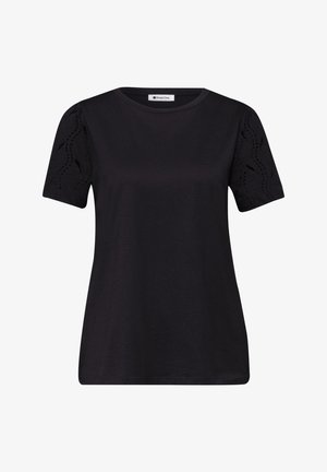 Chemise noire à manches courtes avec col rond et manches à motif en dentelle, étiquetée "Street One" à l'intérieur du col.