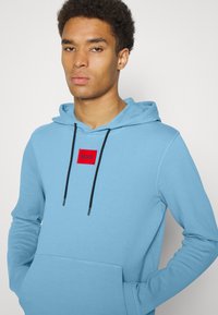HUGO DARATSCHI - Sweatshirt com capuz - turquoise/aqua