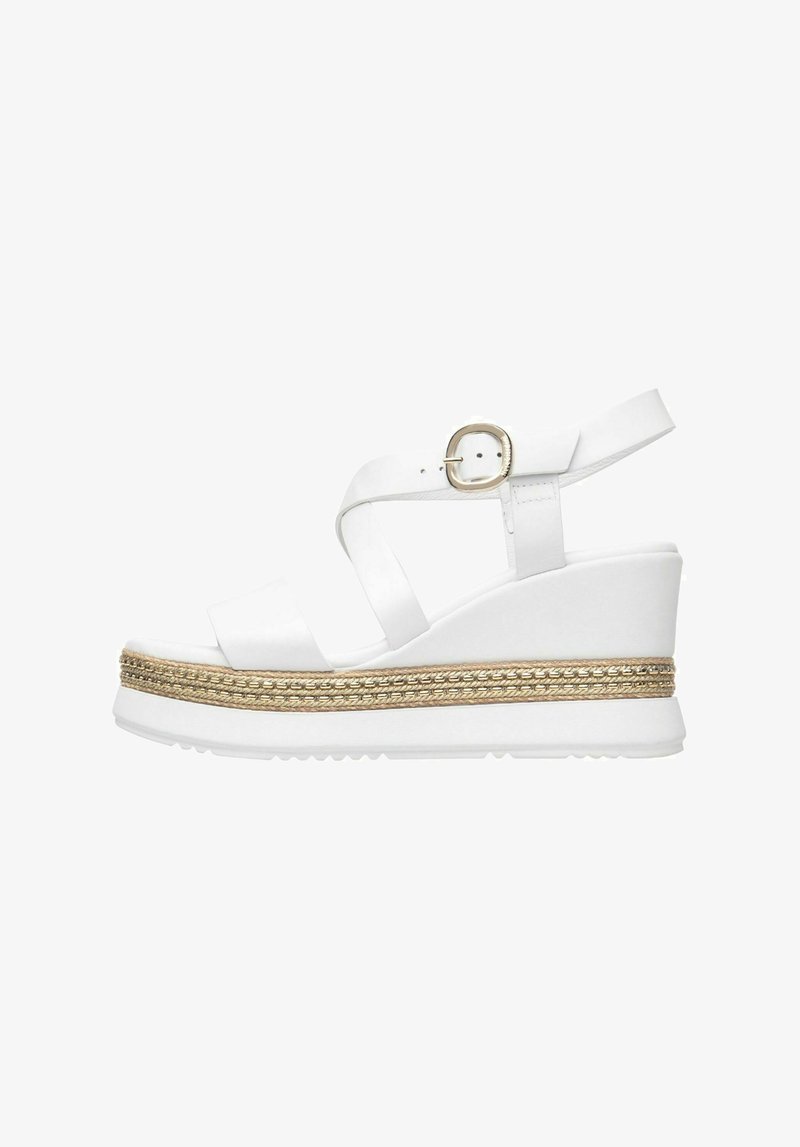 White wedge sandals featuring a wide strap with a buckle, a textured platform with a braided gold accent, and a sturdy rubber sole.